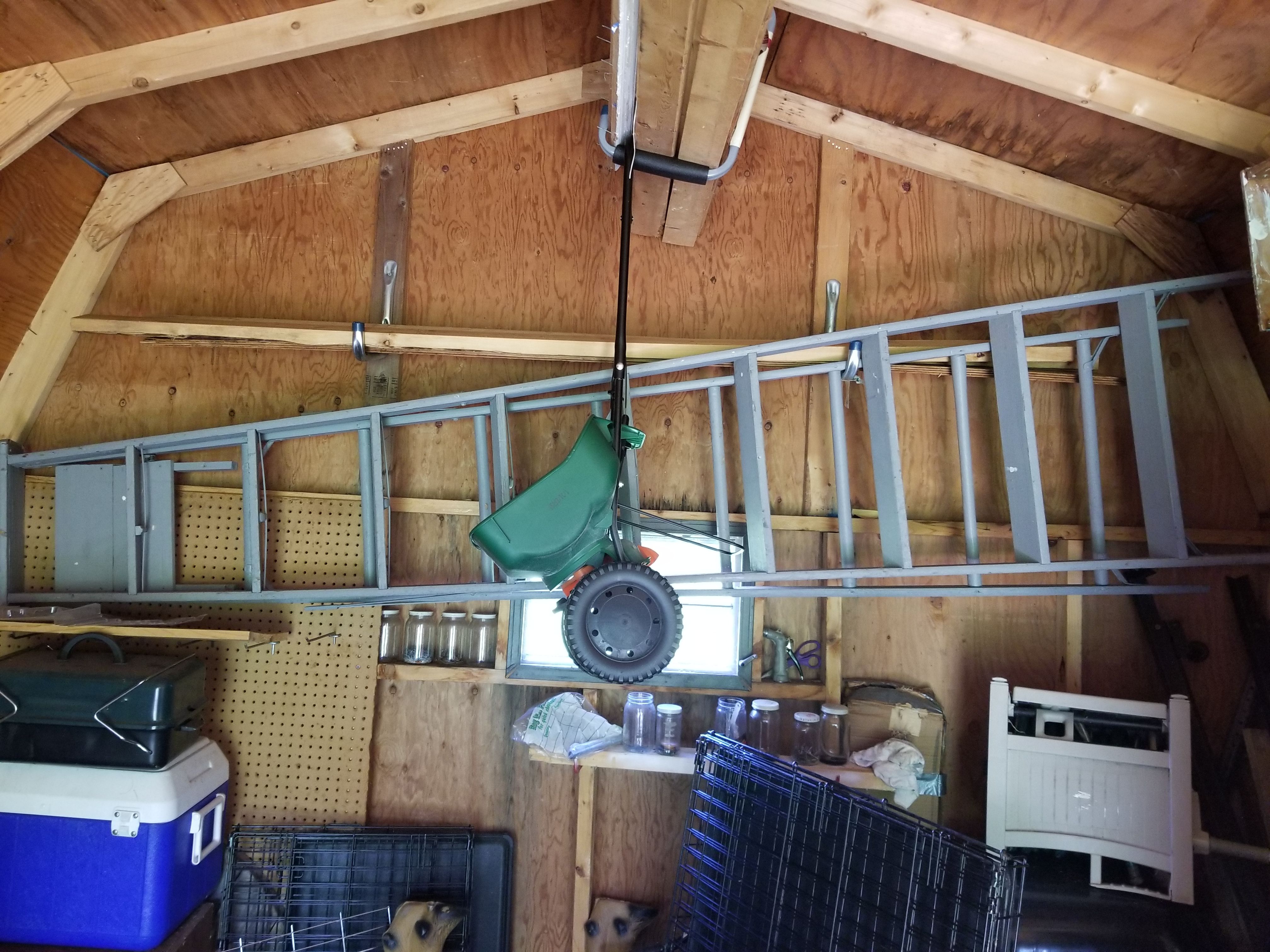 2 older wooden ladders