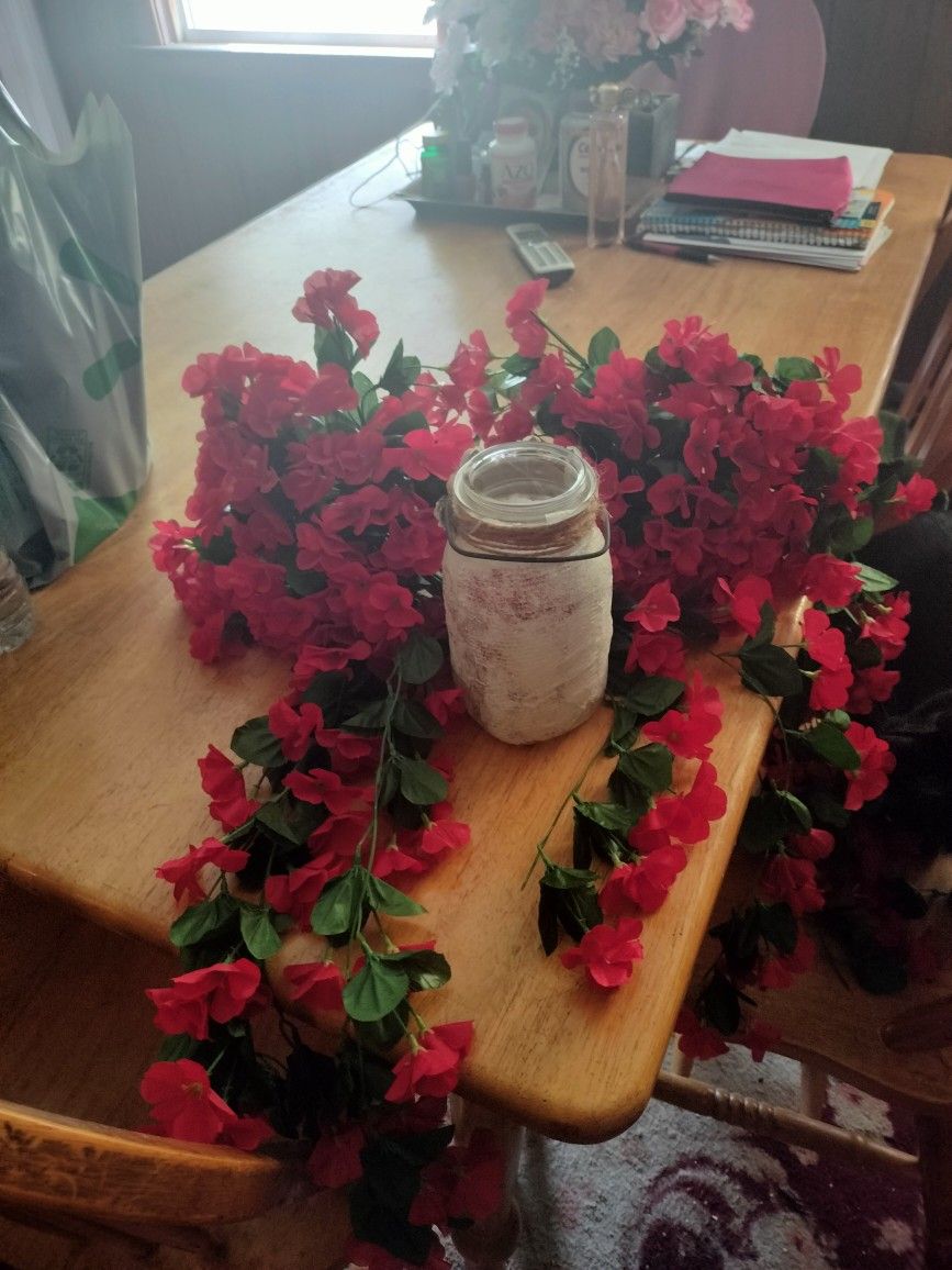 Two Bunches Of Flowers With Vase