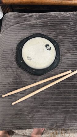 Drum pad with sticks