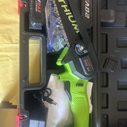 New 6 inch lithium chainsaw. It comes with two batteries, a charger, safety gloves, and safety glasses.