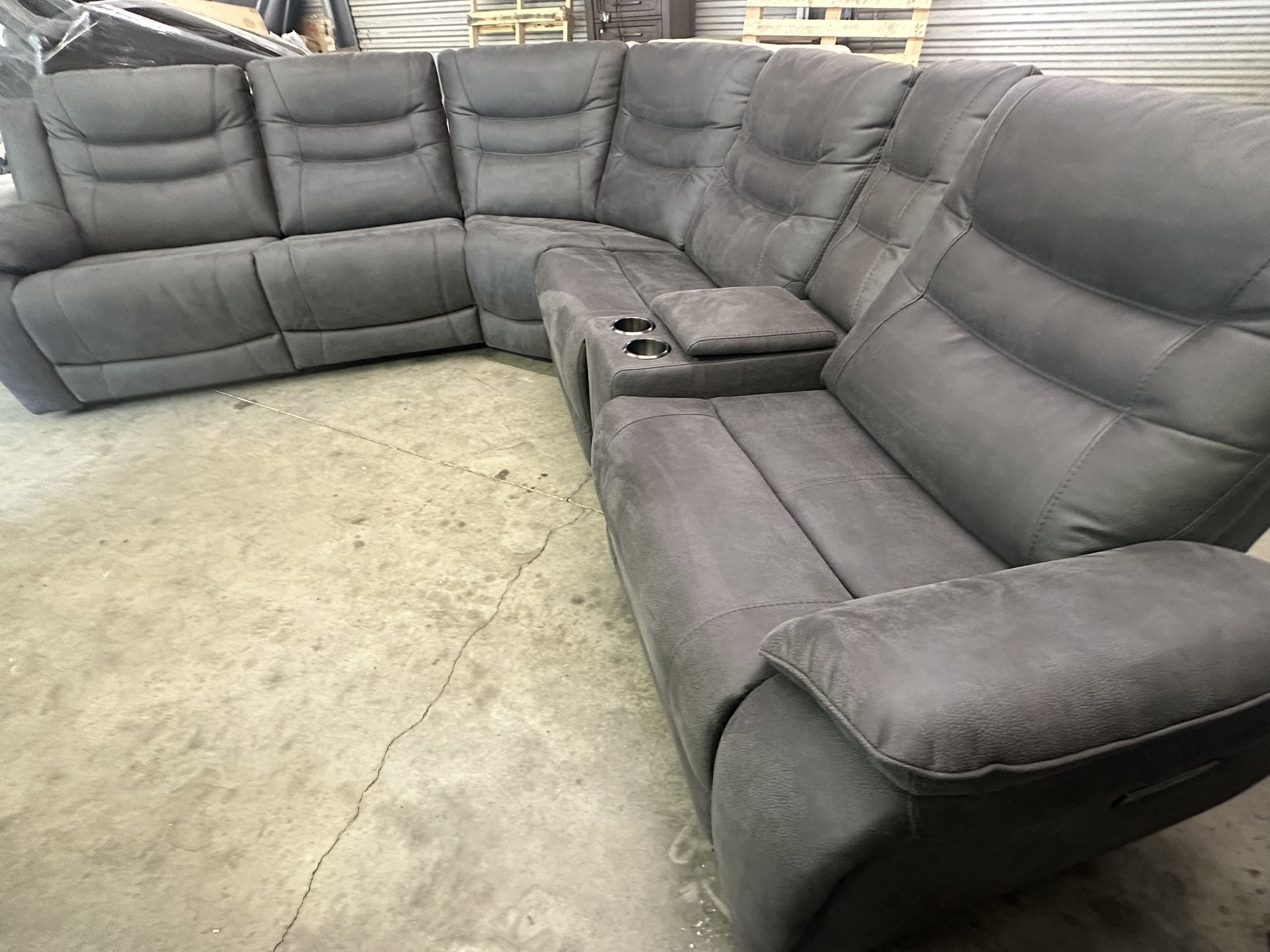 Kelsee Fabric Power Reclining Sectional with Power Headrests Retails for over $2,550 Set is new. Small scrapes from delivery (see last two pics) All