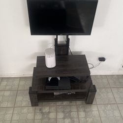 Tv Stand With tv And Xbox One Console 