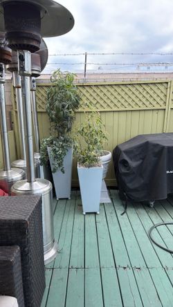 Two artificial plants with nice metal pots