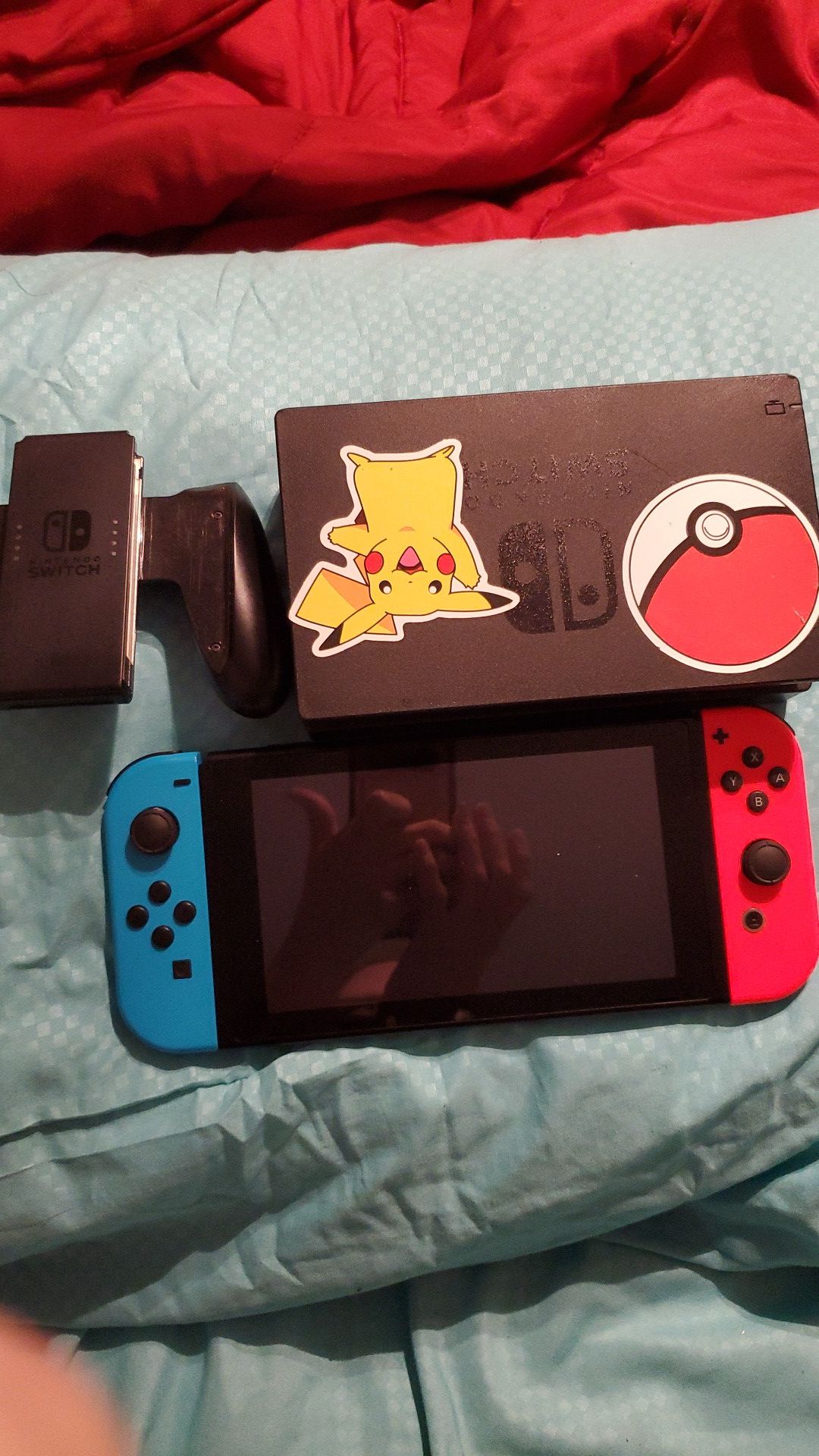 Nintendo switch with neon blue and red joy con