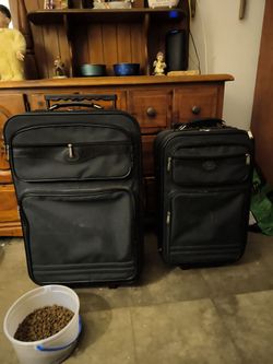 Suit cases with wheels and pullout handles