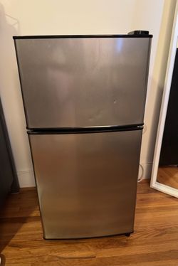Gray mini fridge with freezer