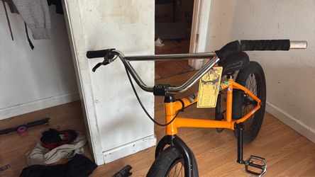 Orange BMX Bike with Chrome Handlebars
