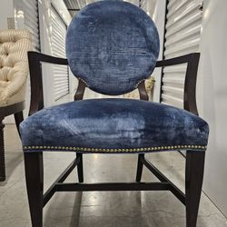 6  Chairs with arms, covered in blue velvet in dark wood. 
