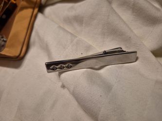 sterling silver feature-hallmarked tie slide (or tie clip).