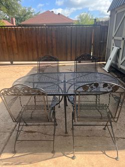 Wrought Iron Patio Set with 4 Rocker Chairs