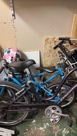 Kids bikes two identical blue bikes with baskets