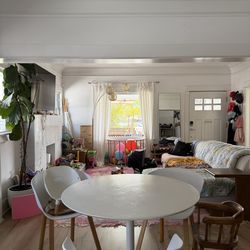 Three white dining chairs