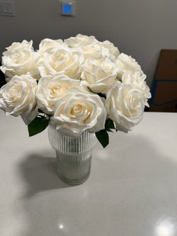 . Modern faux white rose arrangement in a ribbed glass vase