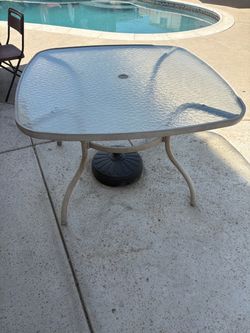 Outdoor patio table with umbrella and base
