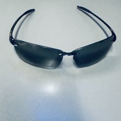 Maui Jim Lighthouse MJ-423-02 Polarized Rimless Sunglasses - Gloss Black Product Overview Experience ultimate comfort and clarity with the Maui Jim Li