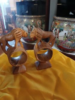 2 hand carved wood lion napkin rings