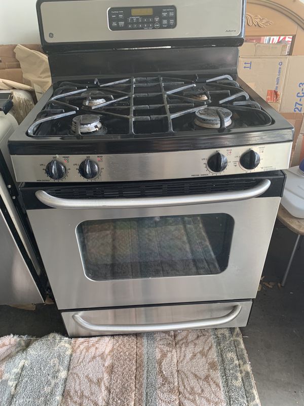 GE Adora stainless Stove, matching GE stainless dishwasher and matching