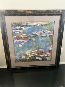 Stunning print of water colors. Heavy wooden frame made to look gold leaf.