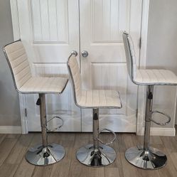3 Adjustable Height Swivel Stools. Can be used for counter or bar stools. Used, in good condition. 

$195 for set of 3 