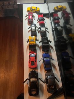 11 die-cast cars/ vehicles