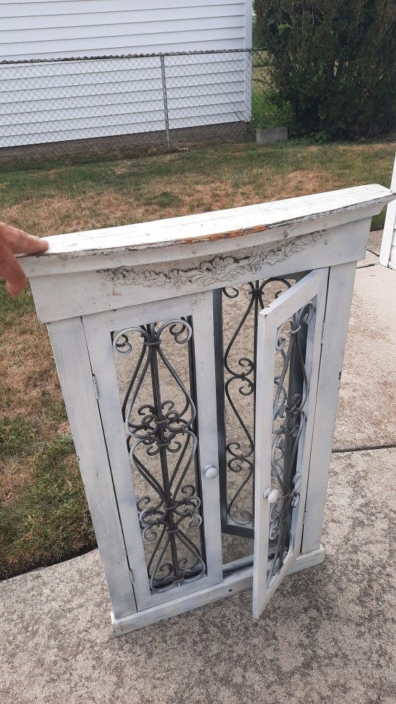 Decorative Ornamental Mirror With Glass Doors.