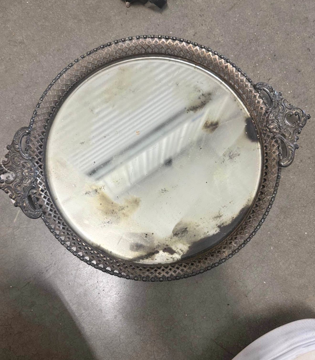 Vintage silver-tone mirrored vanity tray with ornate metalwork and embossed leather base.  Mirrored vanity trays became popular in the late 19th and e