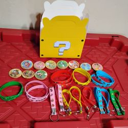 Super Mario buttons, Keychains and Rubber Bracelets lot W/Box 

