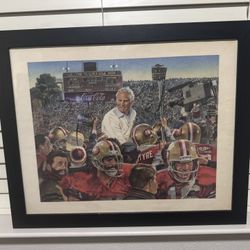 This is a framed print commemorating the San Francisco 49ers' victory in Super Bowl XIX. The print was created by artist Merv Corning