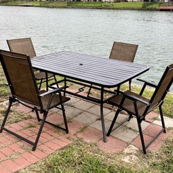 60"L38"W Patio Furniture Outside Patio Table And 4 Patio Chairs . Good Condition