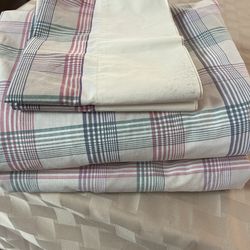 One pair of queen size sheets with matching pillow cases