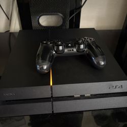 PS4 with remote and games