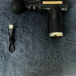 black and gold massage gun