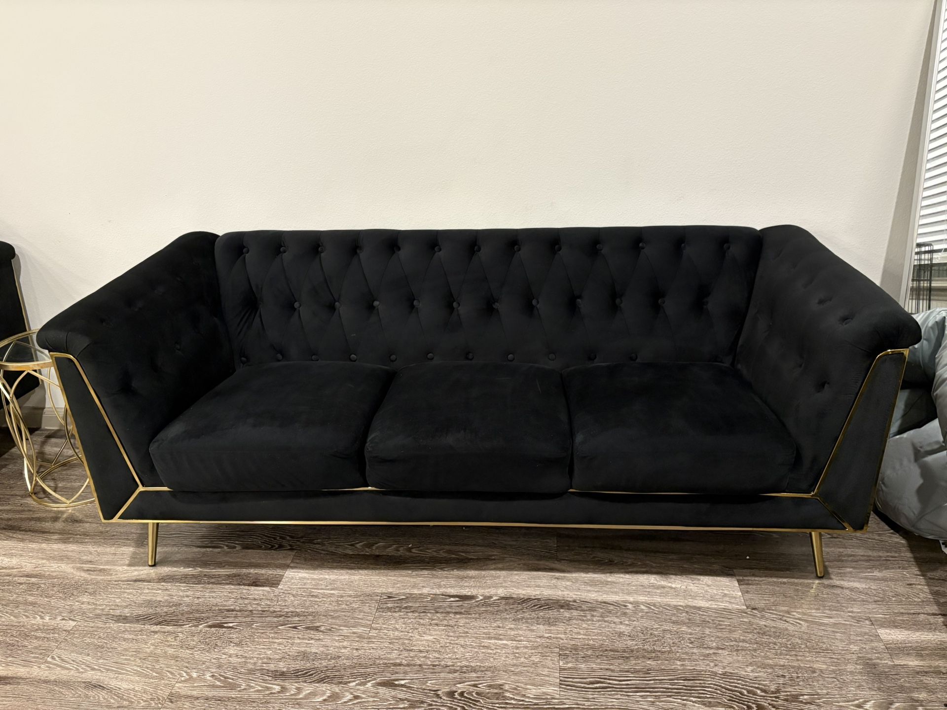 Black Couch With Gold Rim