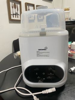 GROWNSY EaseClean Bottle Washer Pro, an all-in-one appliance that washes, sterilizes, and dries baby bottles and accessories.