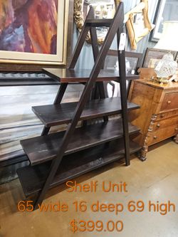 Dark Wood Ladder Shelf Unit We are located at 2811 East Bell road. Another Time Around Furniture.