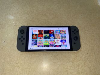 NINTENDO SWITCH OLED + 125 SWITCH GAMES