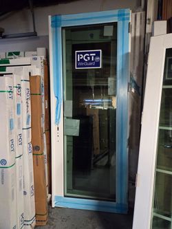 Brand New 74W x 94H PGT Impact Vinyl Double French Doors with Frame, Trims and Handles.