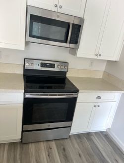 Stove electric glass top stainless steel (4 prong) and over the range microwave stainless steel (3 prong) (free local delivery) $300 for both