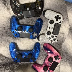 PS4 controllers, brand new, 20 each or 50 for a pair with charging base