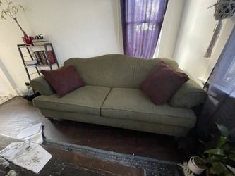 Lovely Emerald Couch With Velvet Ruby Pillows