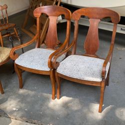 Two Wood Captain Chairs 