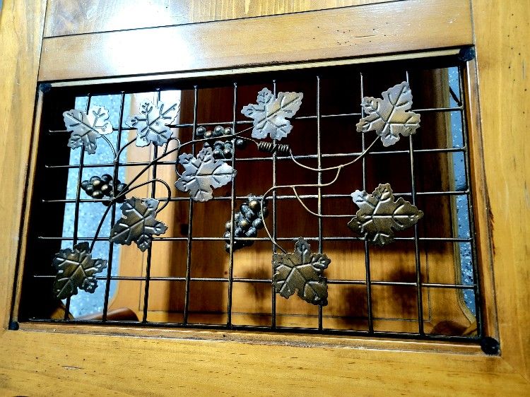 Beautiful Coffee Table with wrought iron grapes.