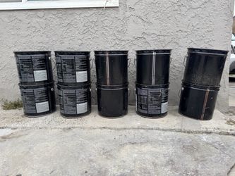 Buckets of glue for wood flooring