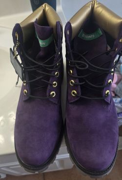 This is a pair of Timberland 6-Inch Premium "Hip Hop Royalty" boots in dark purple nubuck with gold accents. 

Worn One time... No box.. 