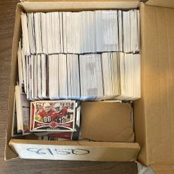 Box Of Baseball And Football Cards.
