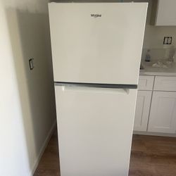 New 24 inch wide 11.6 cu in.  Whirlpool Refrigerator / freezer.