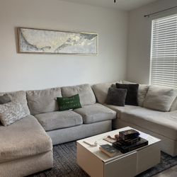 Beige Sectional Couch With A Chaise. 