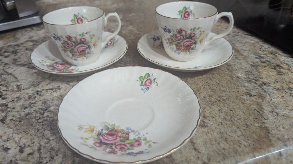 two teacups and three saucers bone china