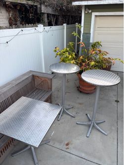 Brushed stainless steel tilt top cocktail tables