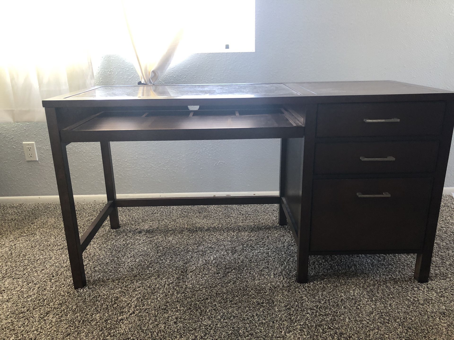 Desk with a file cabinet